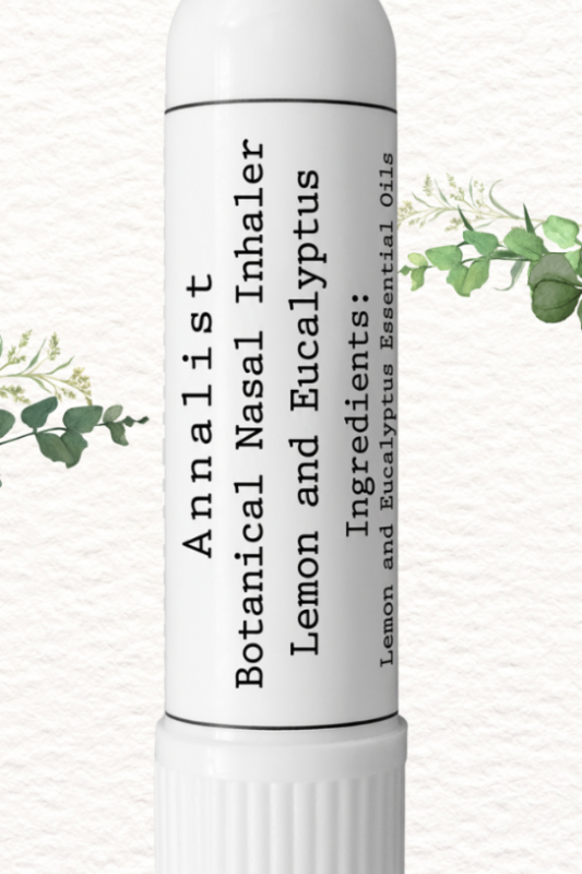 Botanical nasal inhaler with lemon and eucalyptus on a white background